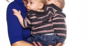 Mom holding Identical twins Mom holding Identical twins