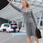 Businesswoman stopping taxi